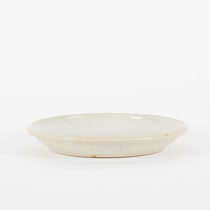 A Pottery Plate With Grey Glaze