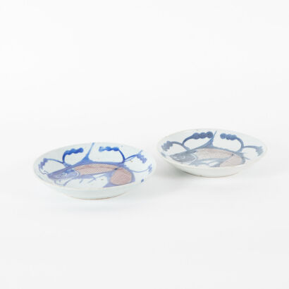 Two Chinese 18th Century Blue and White and Iron-Red 'Fish' Dishes