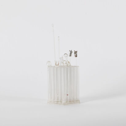 A Collection Of Thirteen Glass Cocktail Swizzle Sticks And Holder