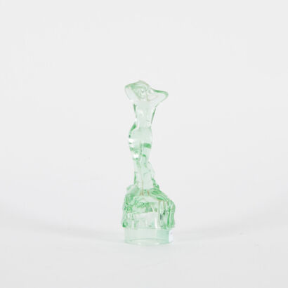 A Green Glass Female Figurine