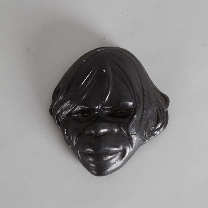 A Face Plaque