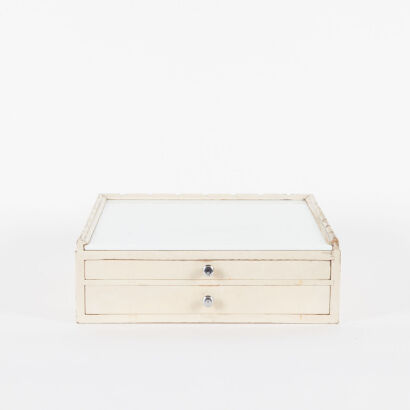 A Vintage Dentist Cabinet With White Glass Top