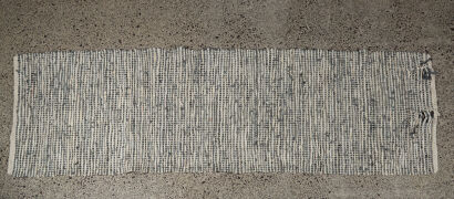 A Woven Leather Floor Rug