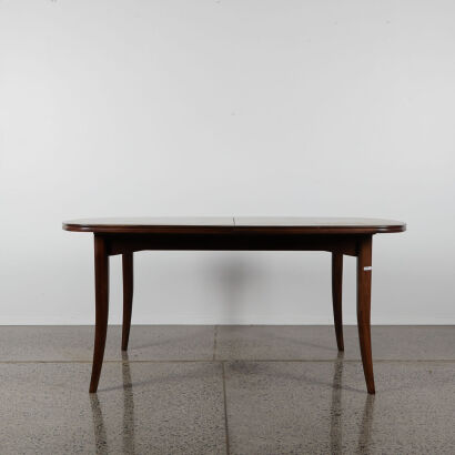 A Mid-Century Extendable Dining Table