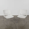 A Pair of Modern White Chairs With Steel Sleigh Base - 2