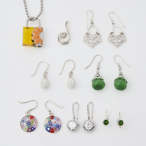 A Collection of Earrings and Charm