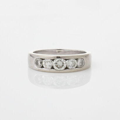 An 18ct White Gold channel set diamond band