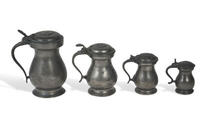 A Set of Four Graduating in Size Lidded Pewter Measures