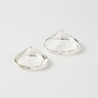 A Pair Of Faceted Glass Decorative Forms