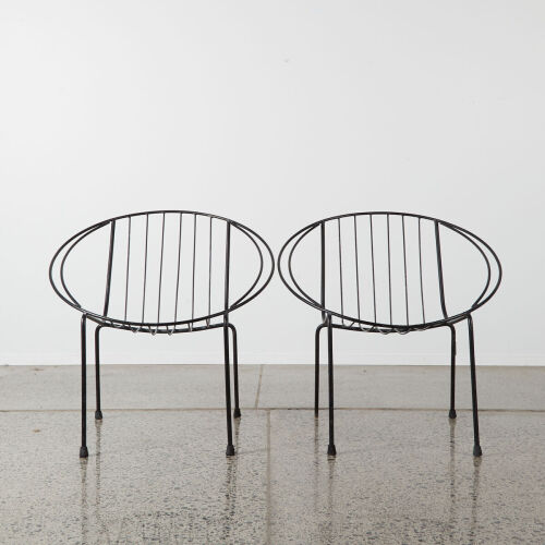 A Pair Of Black Wire Coolie Chairs
