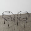 A Pair Of Black Wire Coolie Chairs - 2