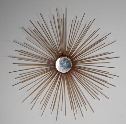 A Gold Decorative Sunburst Wall Hanging