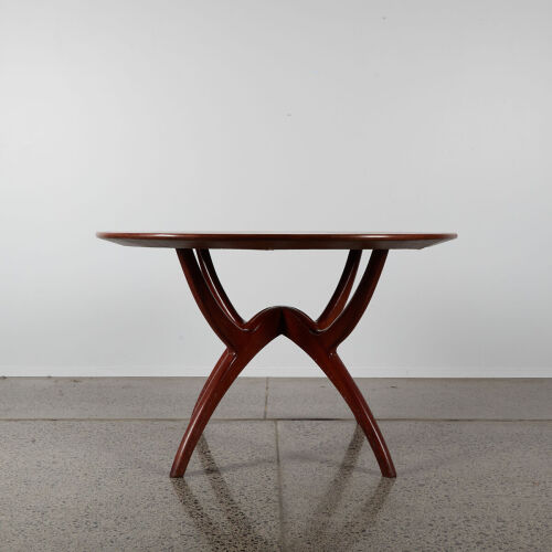 A Mid-Century Circular Dining Table With Spider Base