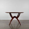 A Mid-Century Circular Dining Table With Spider Base