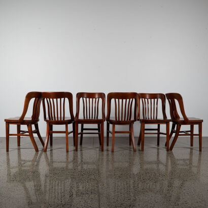 A Suit Of Six Solid Oak Dining Chairs