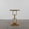 A Gold Hollywood Regency Style Side Table With Mirrored Top