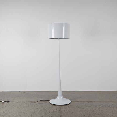 A Floor Standing Lamp With a Pedestal Base