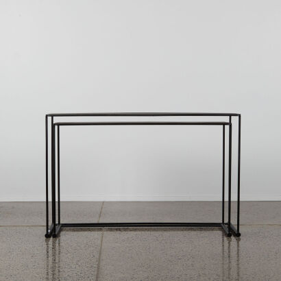 A Pair Of Black Metal Nesting Console Tables