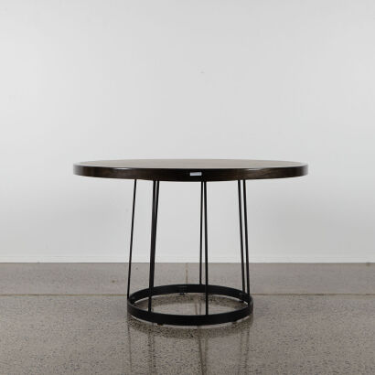 A Circular Dining Table With Timber Inlaid Top And Wrought Iron Base