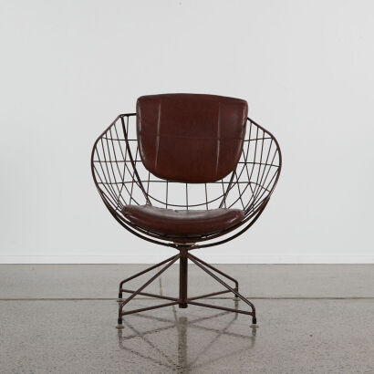 An Atomic Metal Wire And Vinyl Swivel Chair