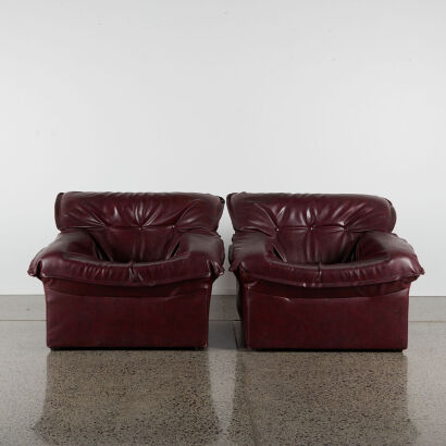 A Pair Of Burgundy Vinyl Lounge Chairs