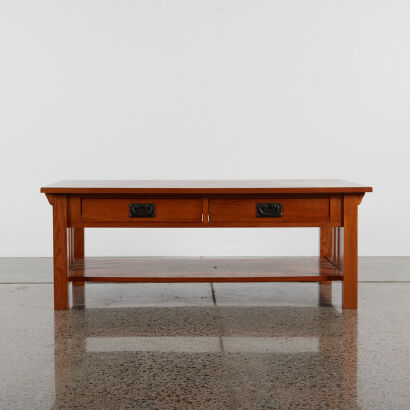 An Oak Coffee Table With Drawers And Bowtie Inlay