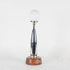 An Art Deco Chrome Bullet Table Lamp With An Oak Base