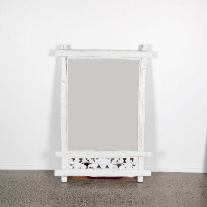 A Large Rustic Mirror With White Wooden Frame