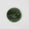 A Silver Bound Edge Pounamu Circular Object