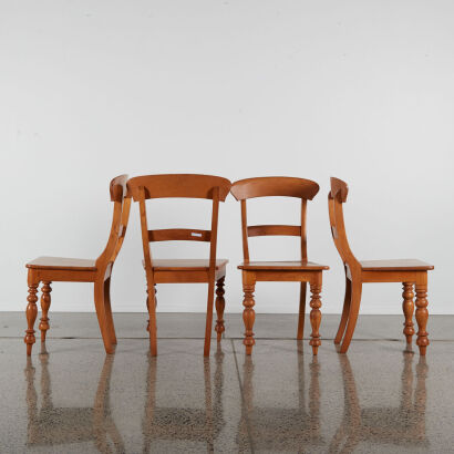 A Set Of Four Bar Backed Dining Chairs