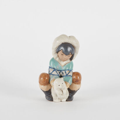 A Lladro Inuit and Polar Bear Ceramic