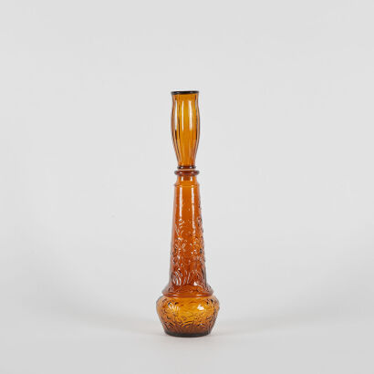 An Amber Glass Floral Portuguese Bottle With Stopper