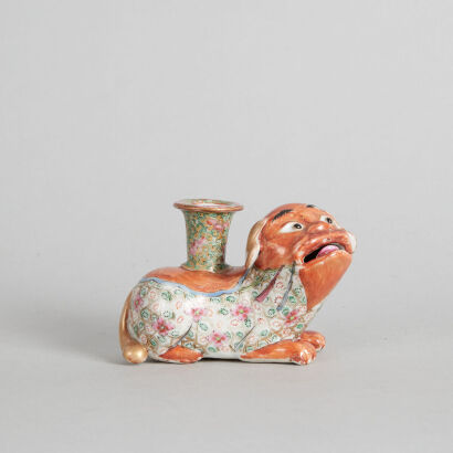 A Chinese Qing Dynasty Canton Famille Rose Foo Dog Candlestick