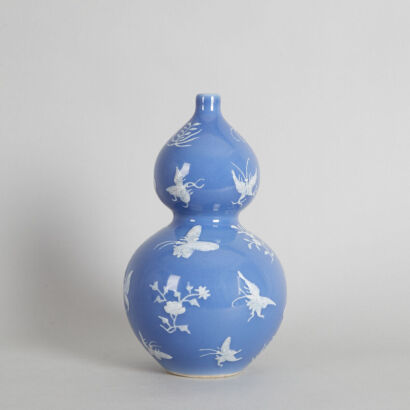 A Chinese Mid to Late Qing-Dynasty 'Clair-de-lune'-Glazed 'Butterfly' Double-Gourd Vase (Da Qing Qianlong Nian Zhi Mark)