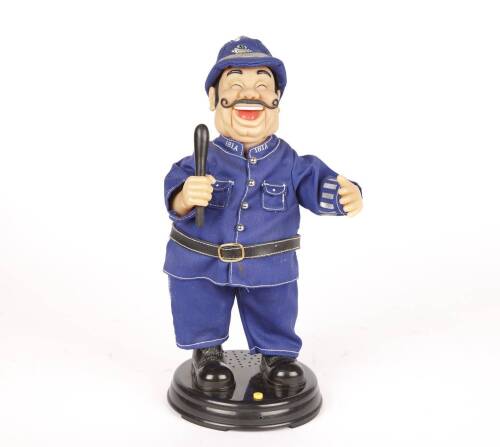 A Battery Operated Composite Laughing Policeman Figure