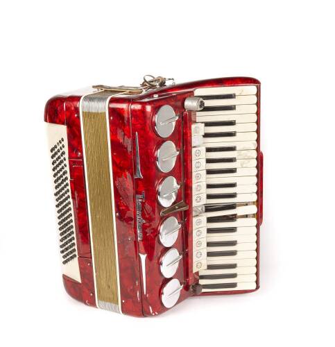 A Mottled Red Plastic Tientan Piano Accordion