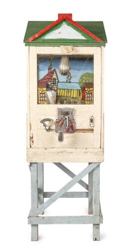 An Old Painted Wooden House Pistol Shooting Arcade Game.