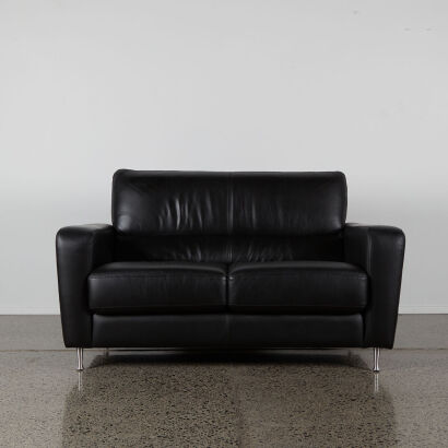 A Contemporary Two Seater Black Leather Couch