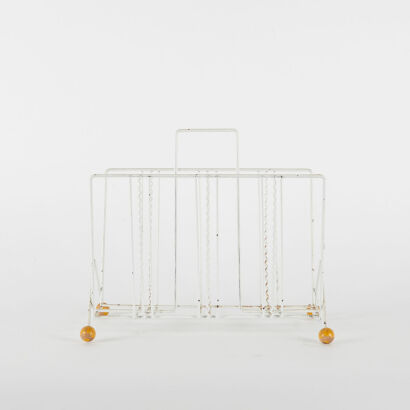 A Retro Wire Magazine Rack With Wooden Ball Feet,