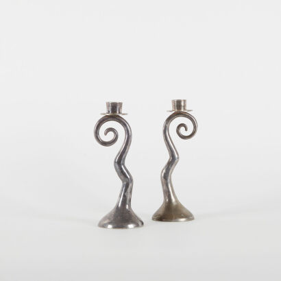 A Pair Of Vintage Cast Aluminium Candle Holders