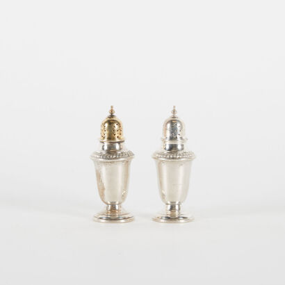 A Pair Of Sterling Silver Salt And Pepper Shakers