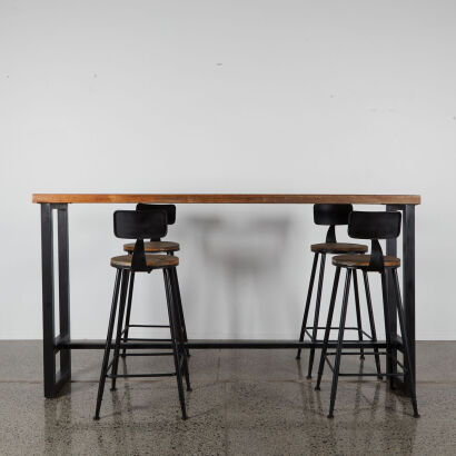 A Bar Leaner With Four Stools