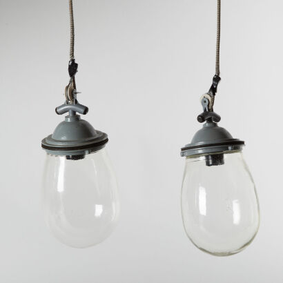 A Pair Of Industrial Glass Orb Pendant Lights