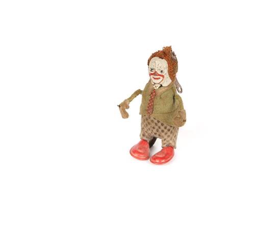 A Small Schuco Tinplate Clockwork Clown Toy