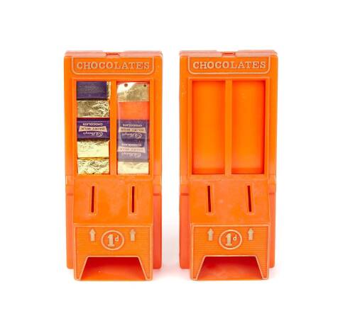 Two Orange Plastic Penny Cadburys Chocolate Machines
