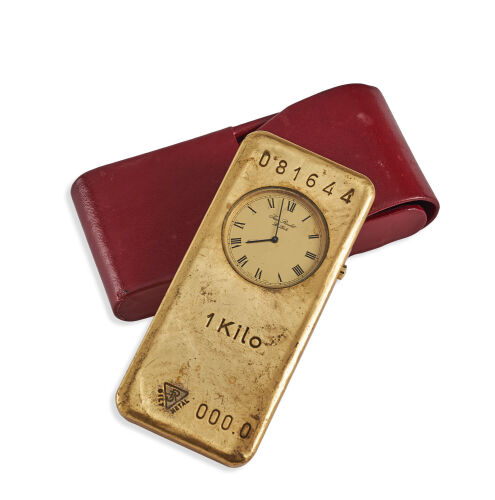 A Jean Roulet "Golden" Ingot Shaped Desk Clock With Alarm Case