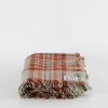 A Orange Plaid Kaiapo Huia Wool Travel Rug