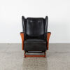 A Vintage Wingback Rocker in Black Upholstery