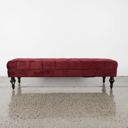 A Maroon Velvet Ottoman