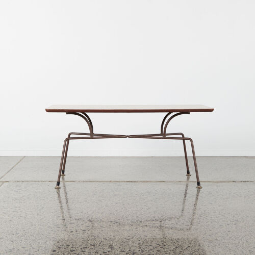 A Mid-Century Coffee Table With Steel Legs